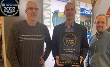 Three men stand with the HPC Wire Award