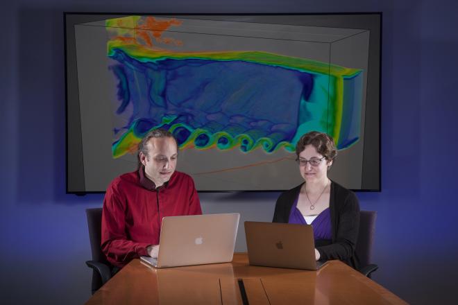 Aaron Fisher and Laura Weber review a blast visualization